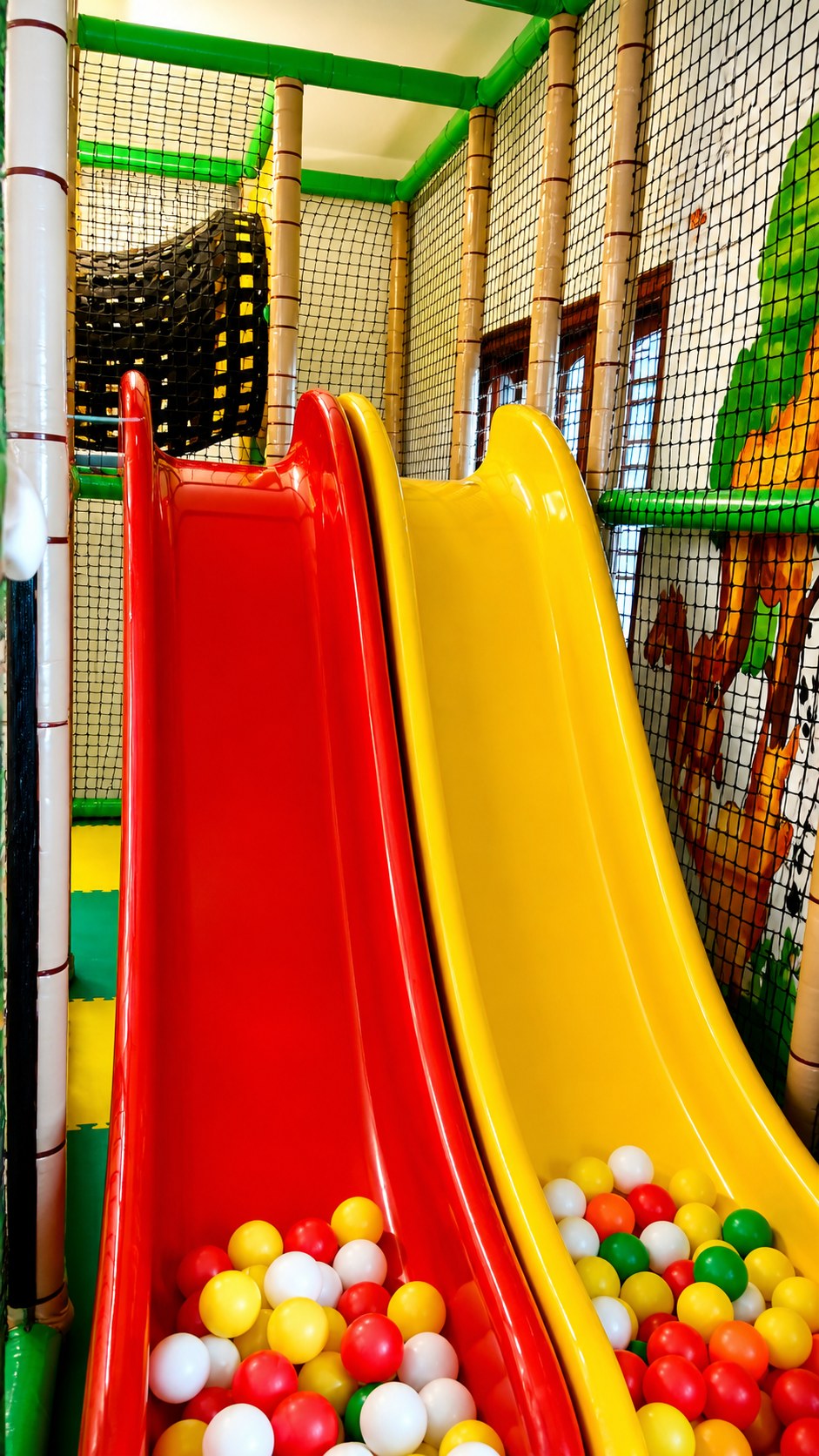 Space-themed indoor play zone with astronaut mural at Navashiksha HSR Layout